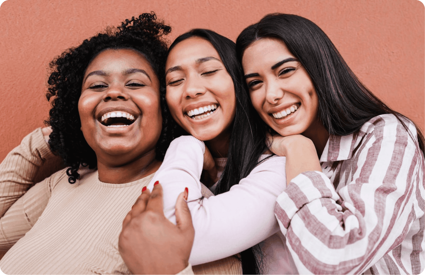 Three women smiling together